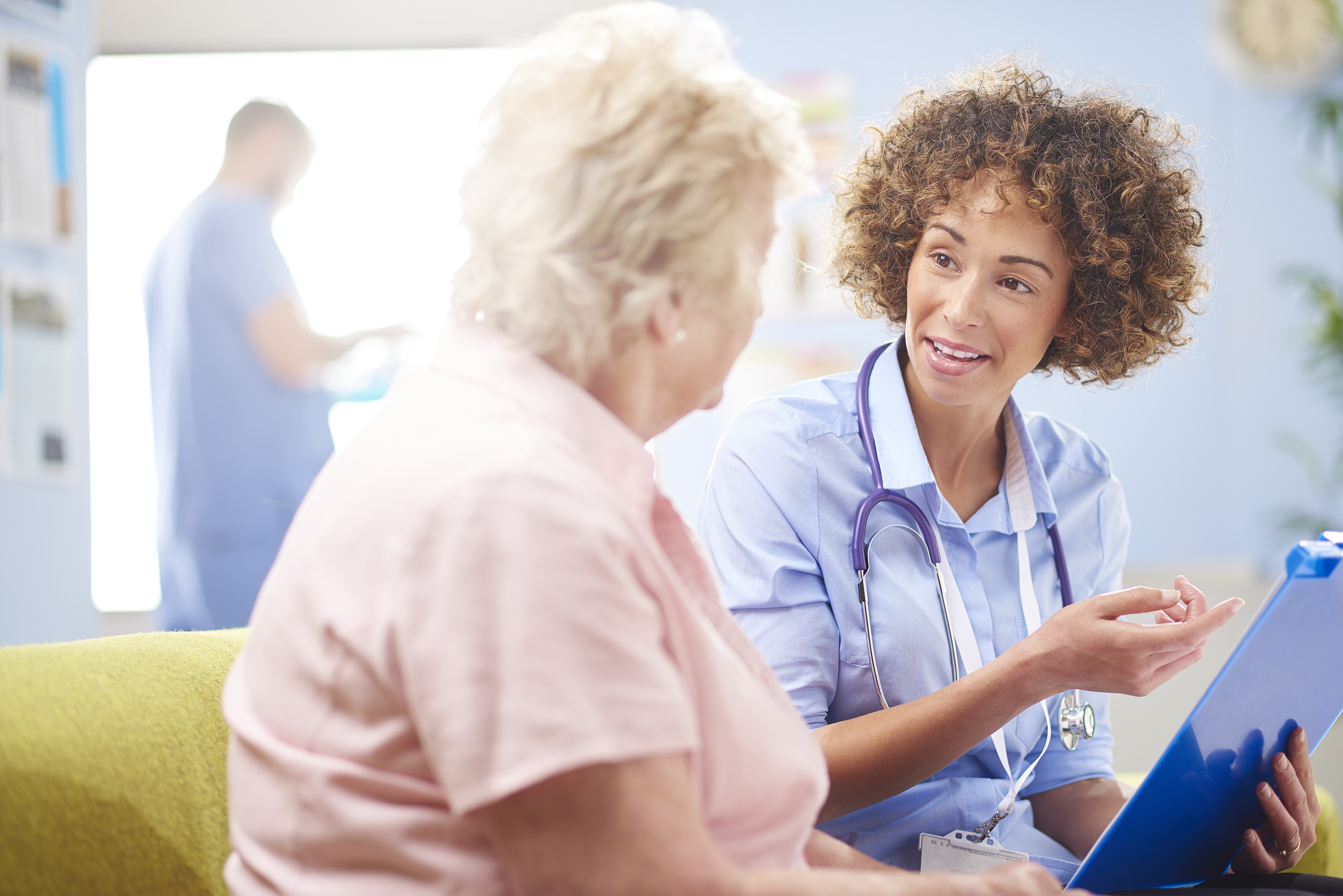 Woman talking to a nurse