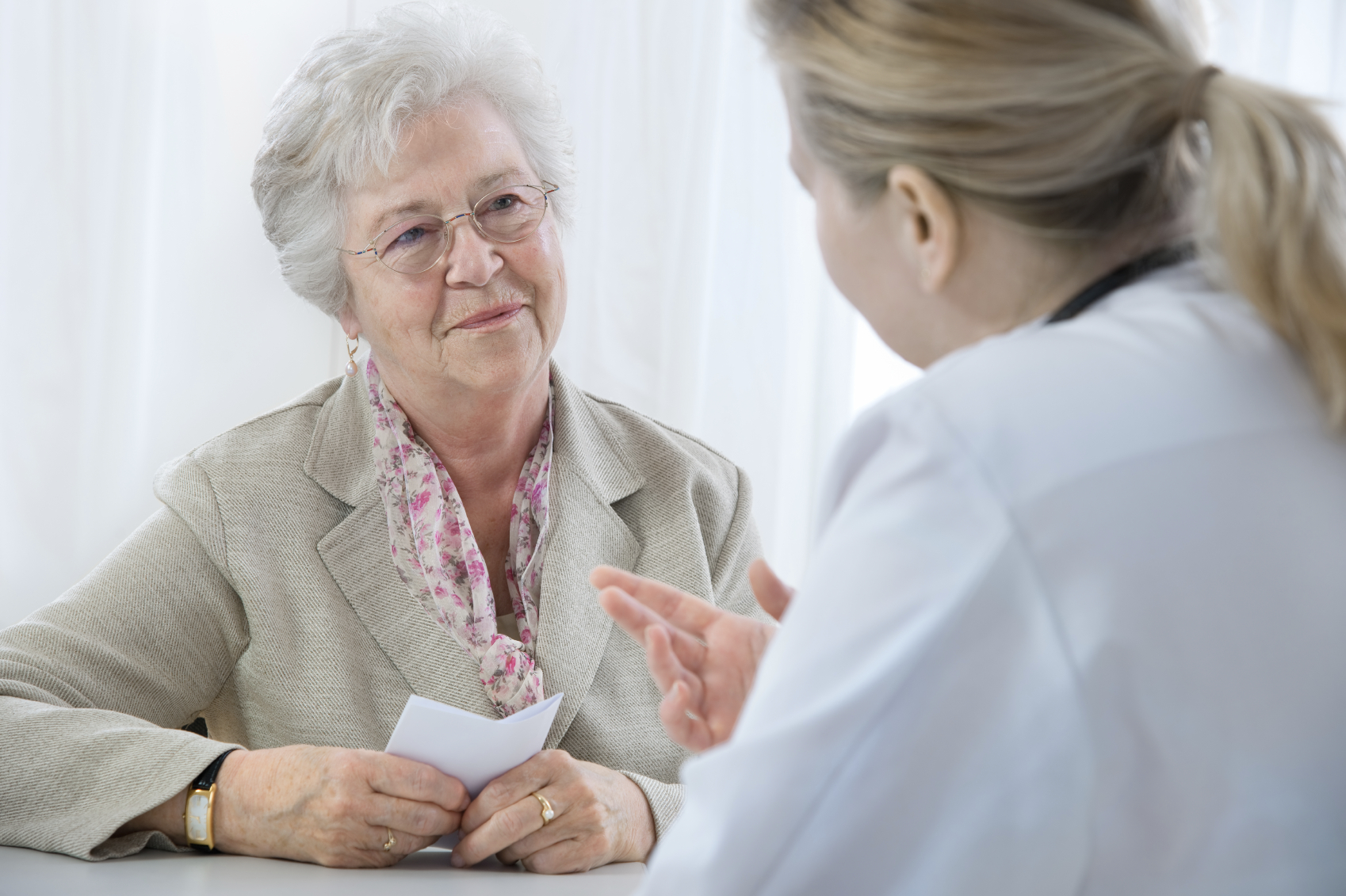 Older woman talking to her doctor