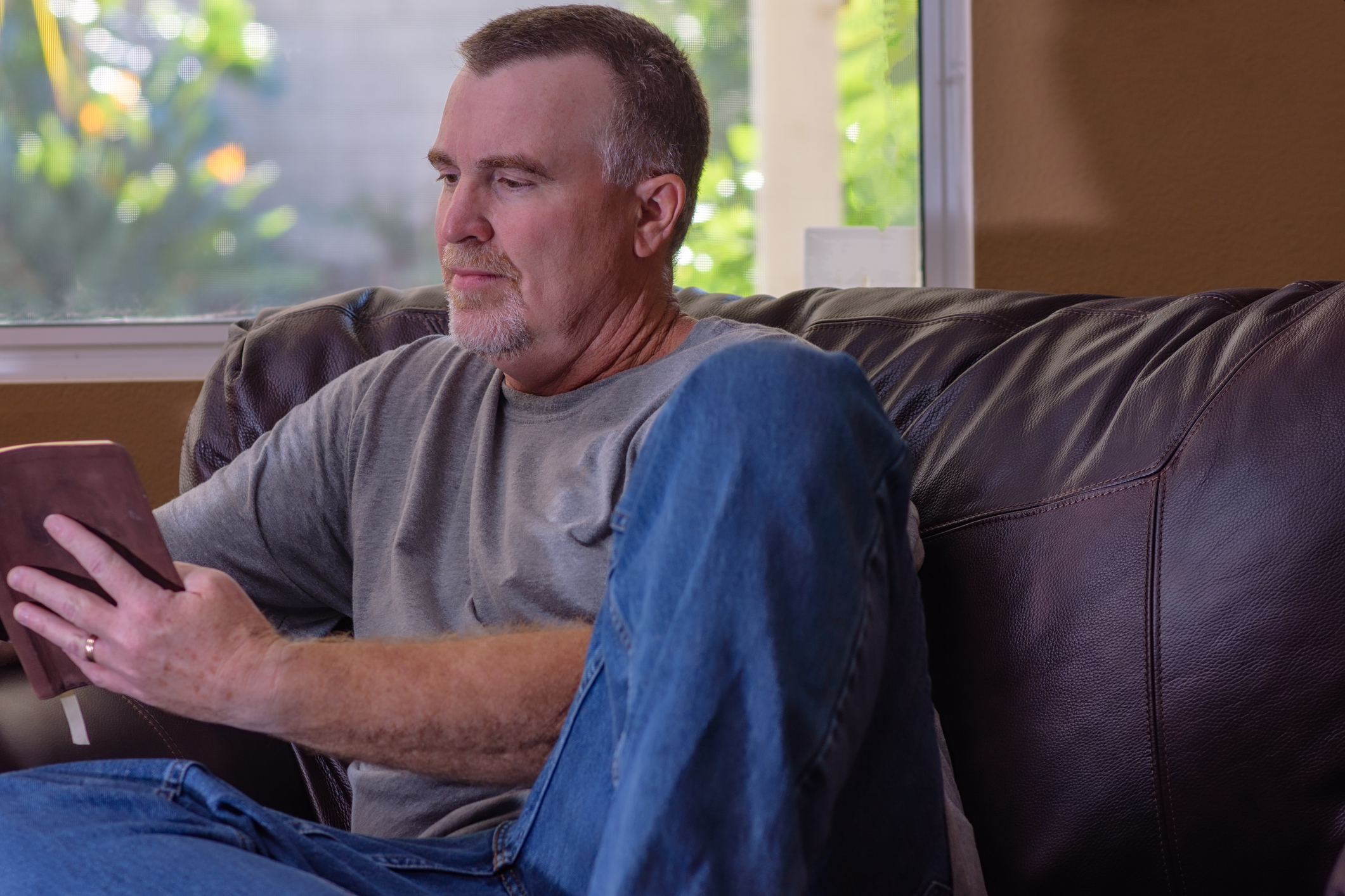 Middle aged man reading