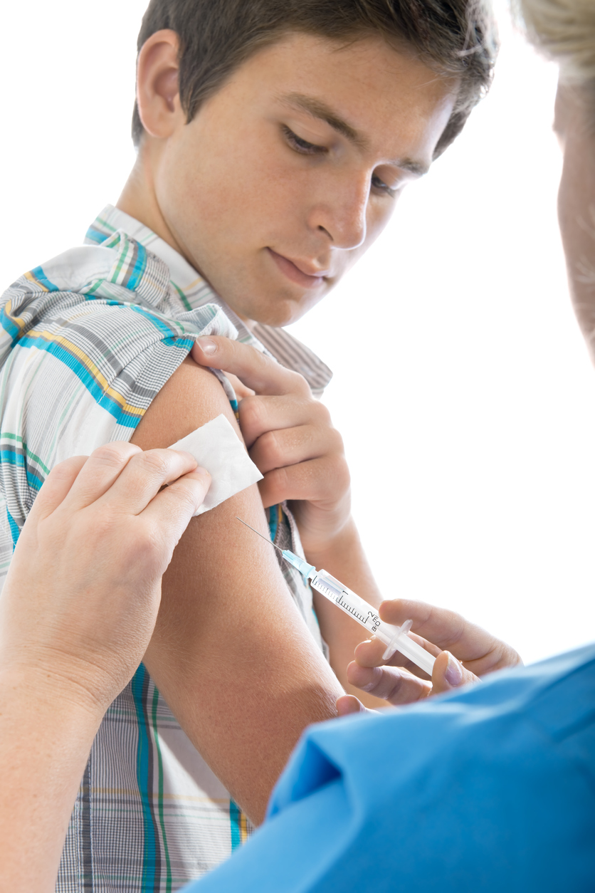 Teenage boy getting a needle