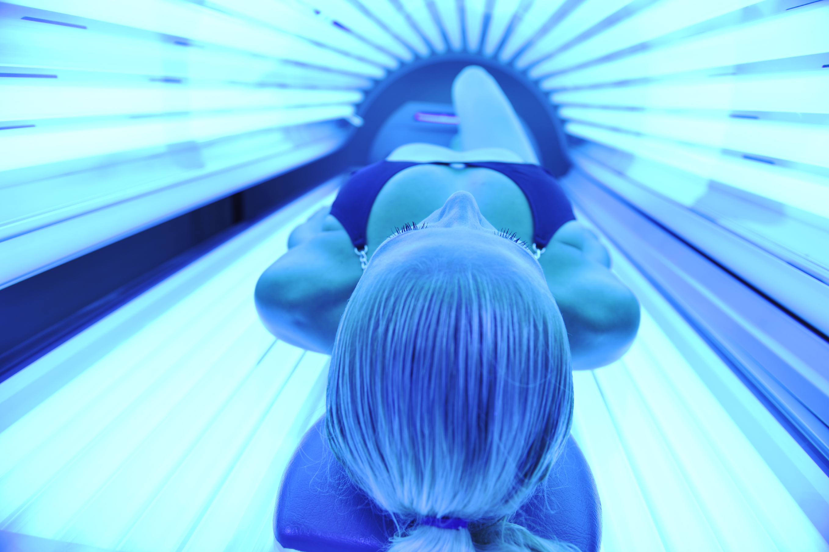 Woman in sunbed