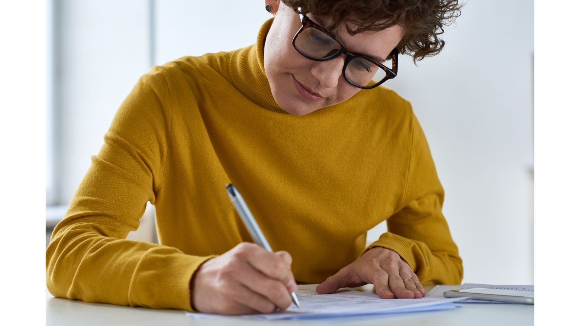 Person filling in a form / paperwork