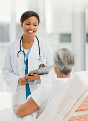 Young female doctor talking to a female patient