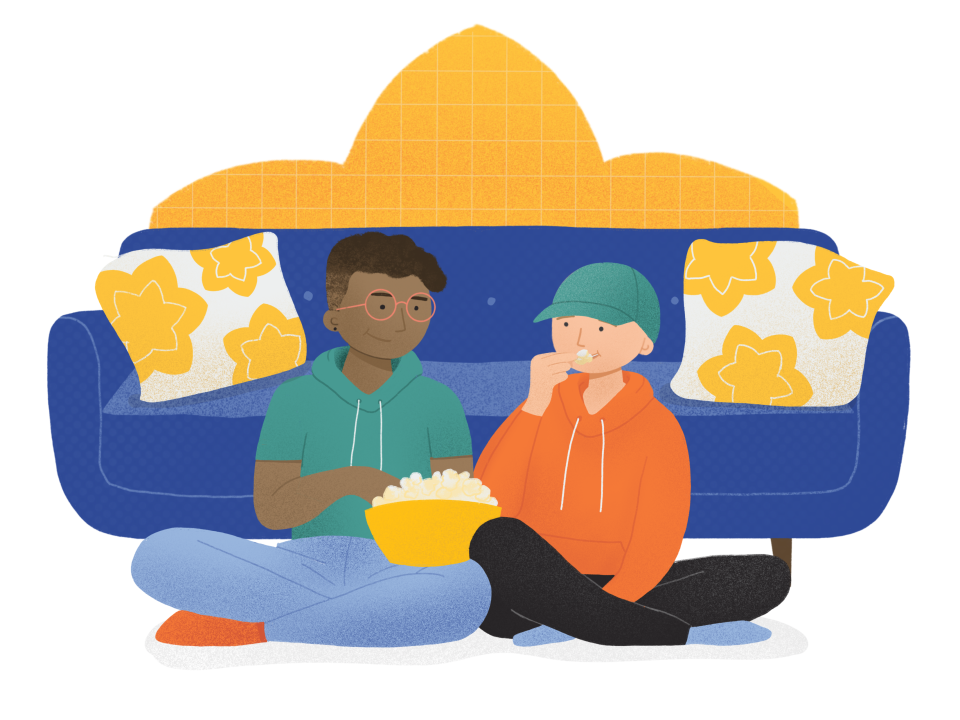 Bald child eating popcorn with a friend