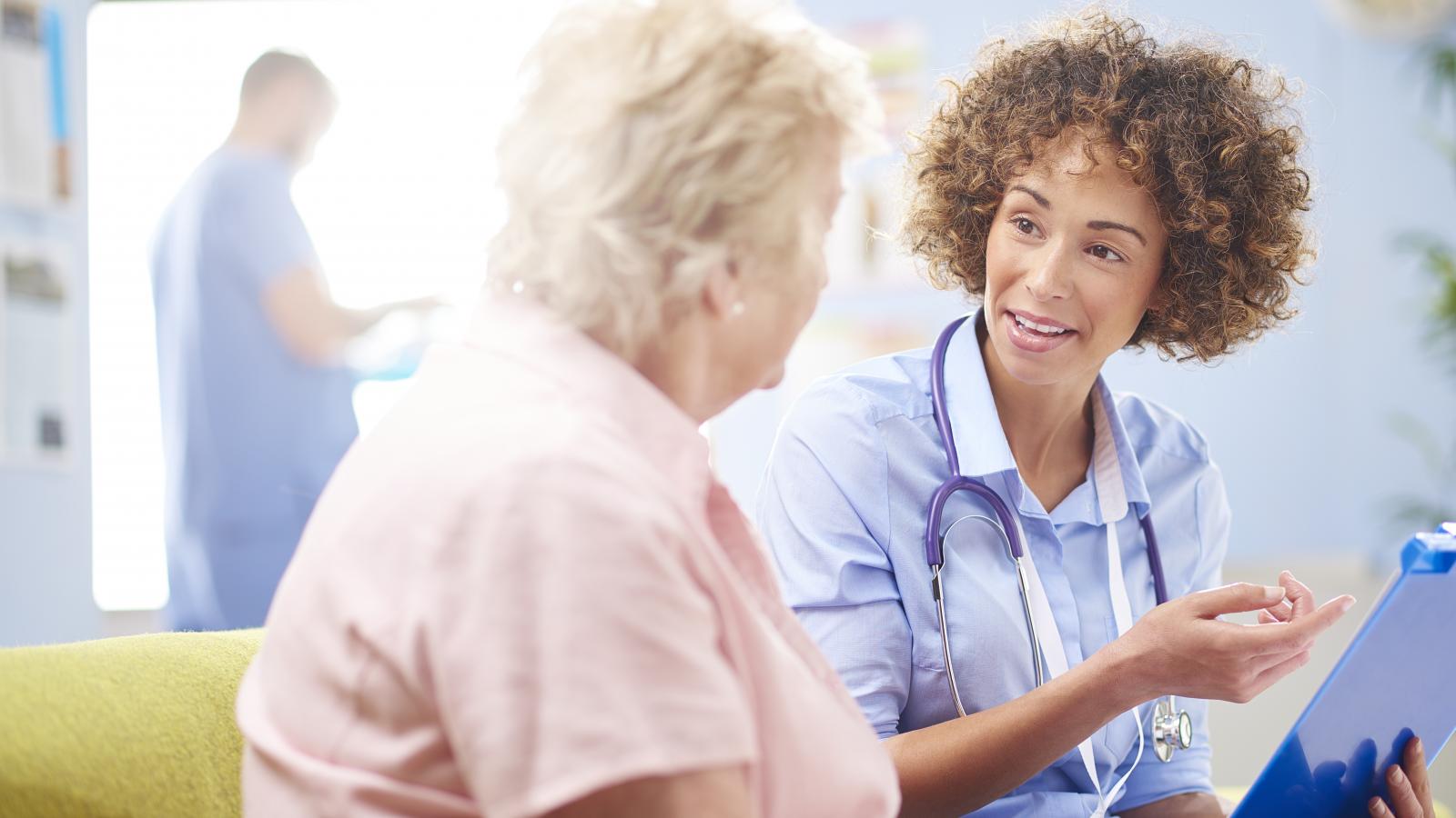 Woman talking to a nurse