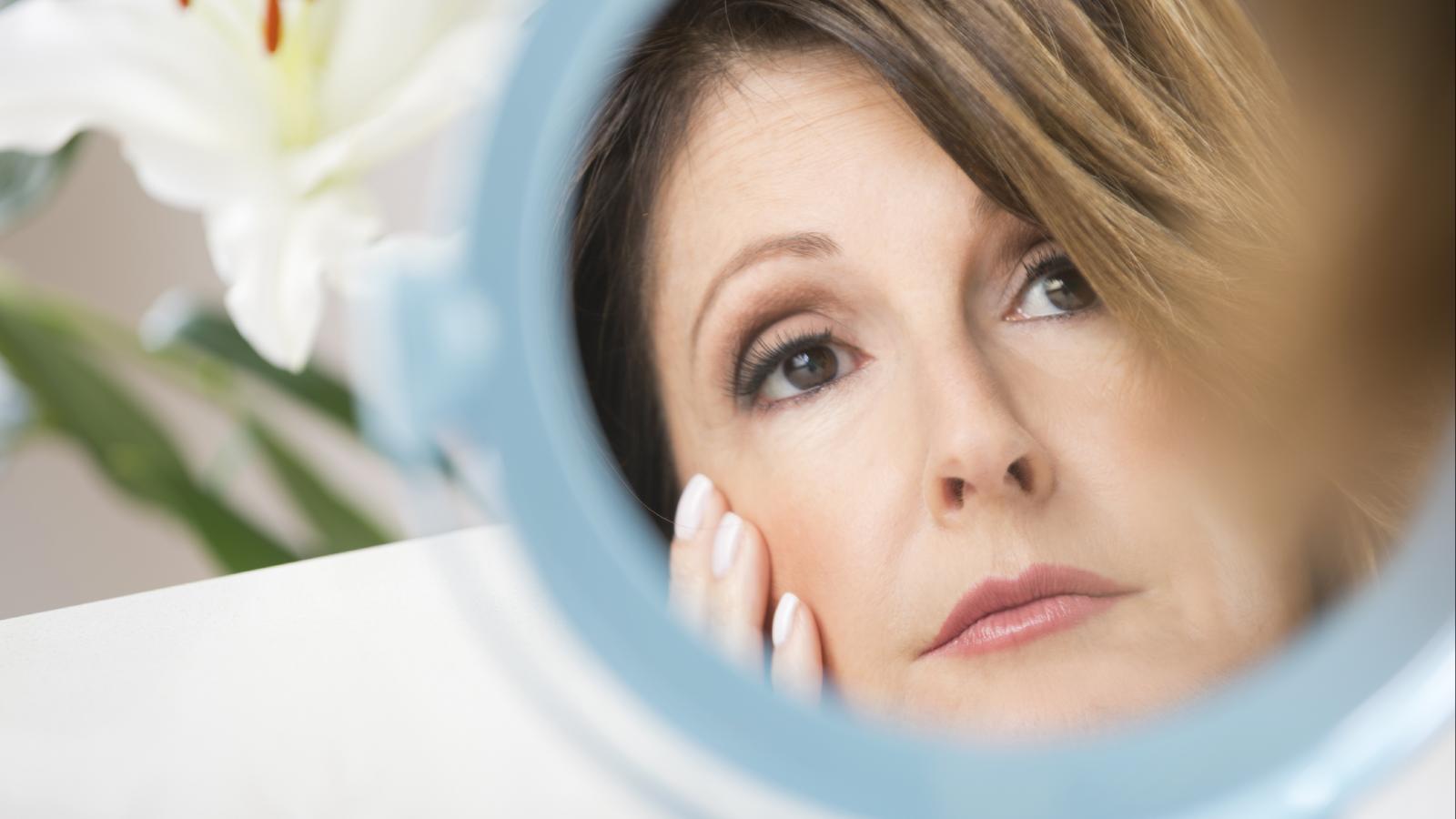 Woman looking in a mirror