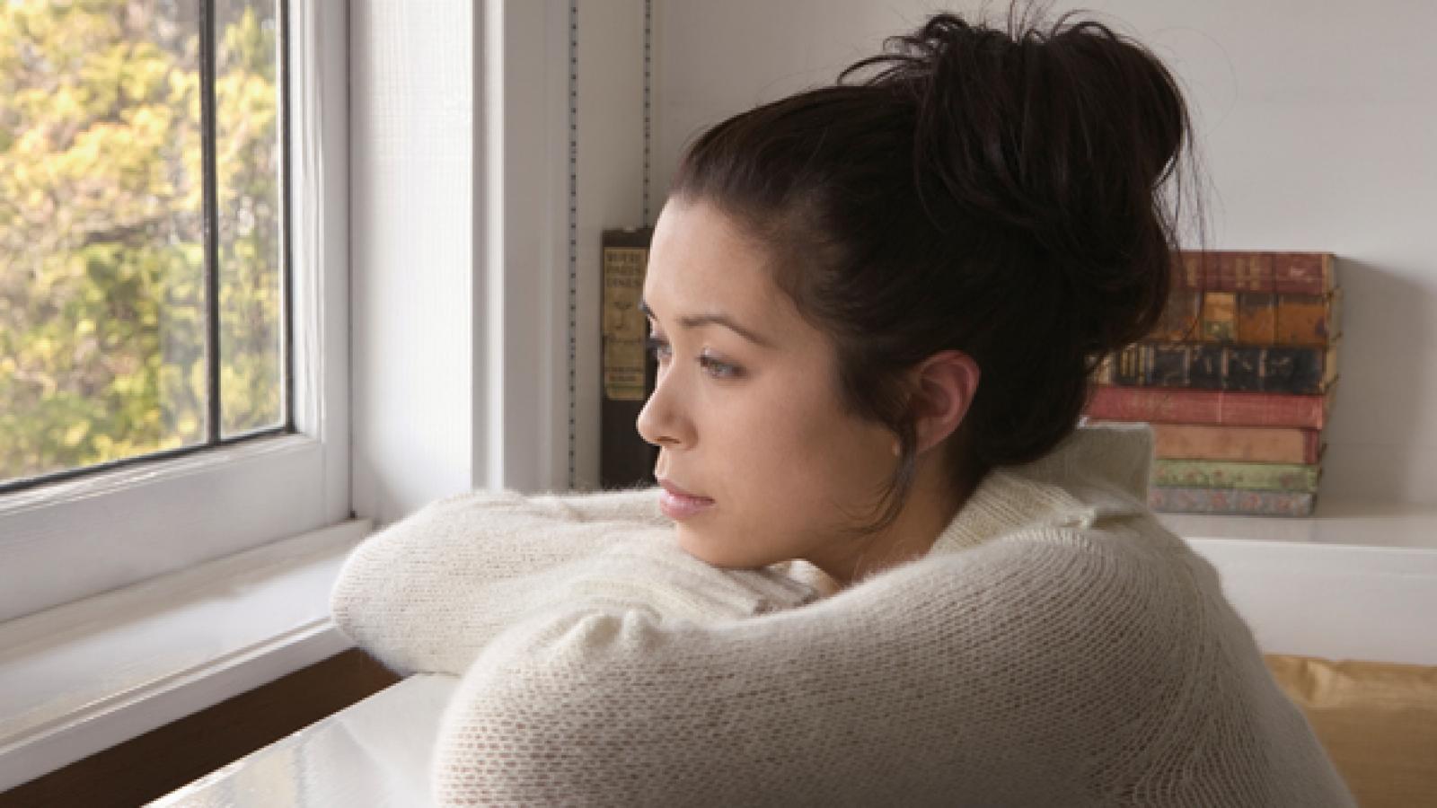 Woman looking out the window