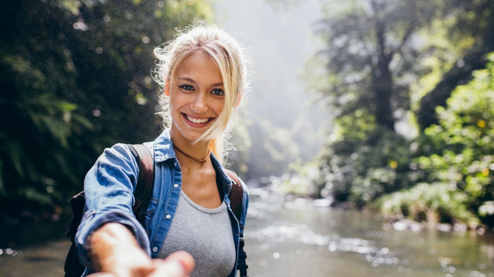 Young woman by a river