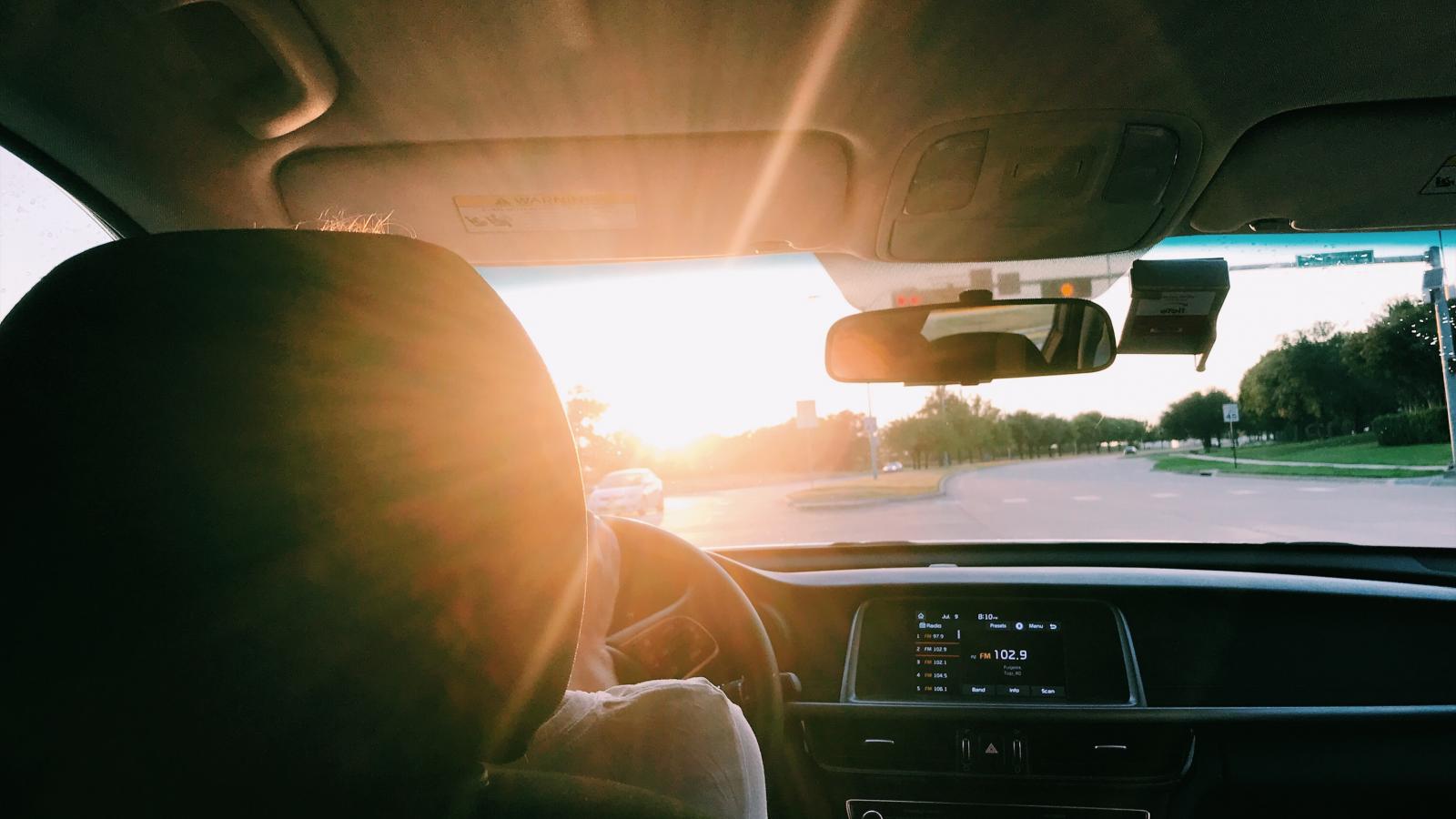 View of a road from the driver's seat of a car