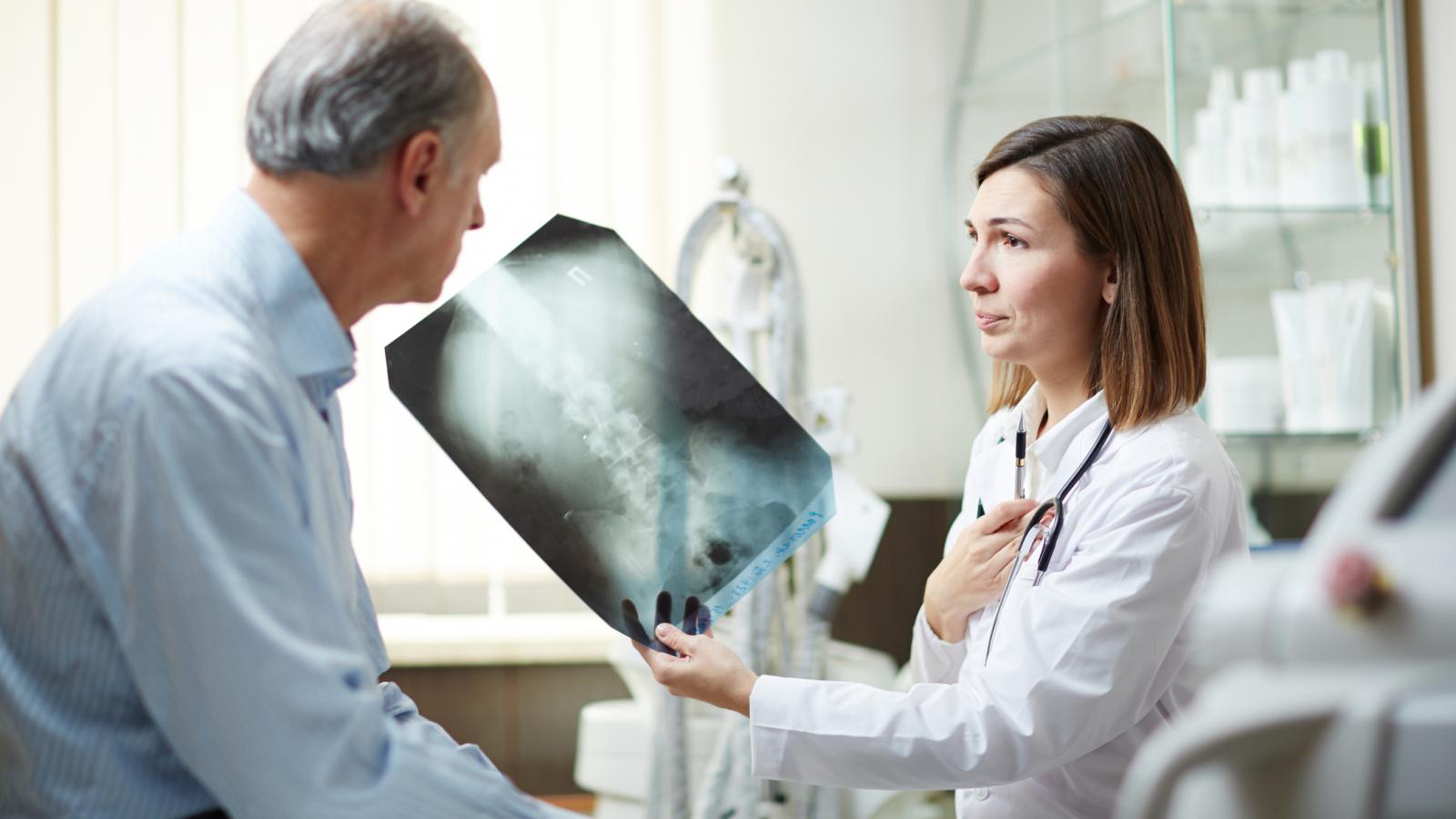 Doctor showing man an x-ray