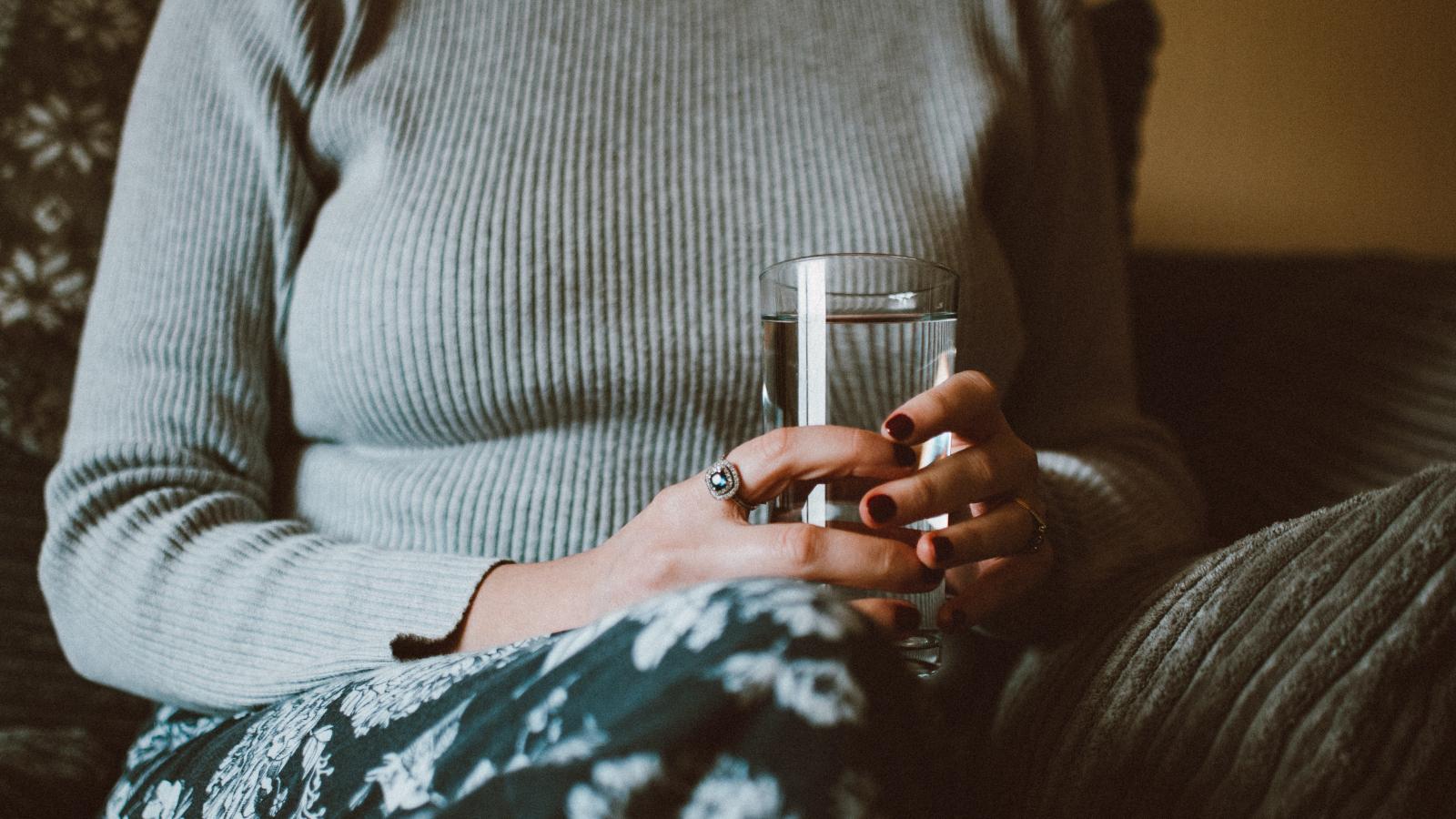 older woman glass water
